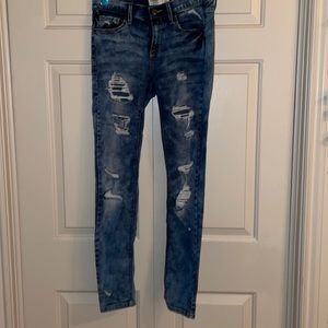 LOW RISE SKINNY RIPPED JEANS